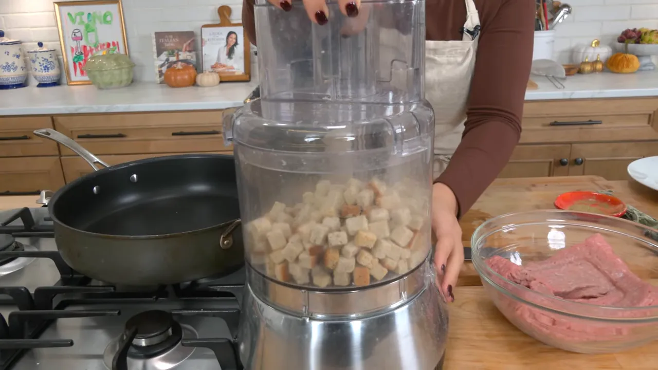 Stuffing cubes being pulsed into breadcrumbs