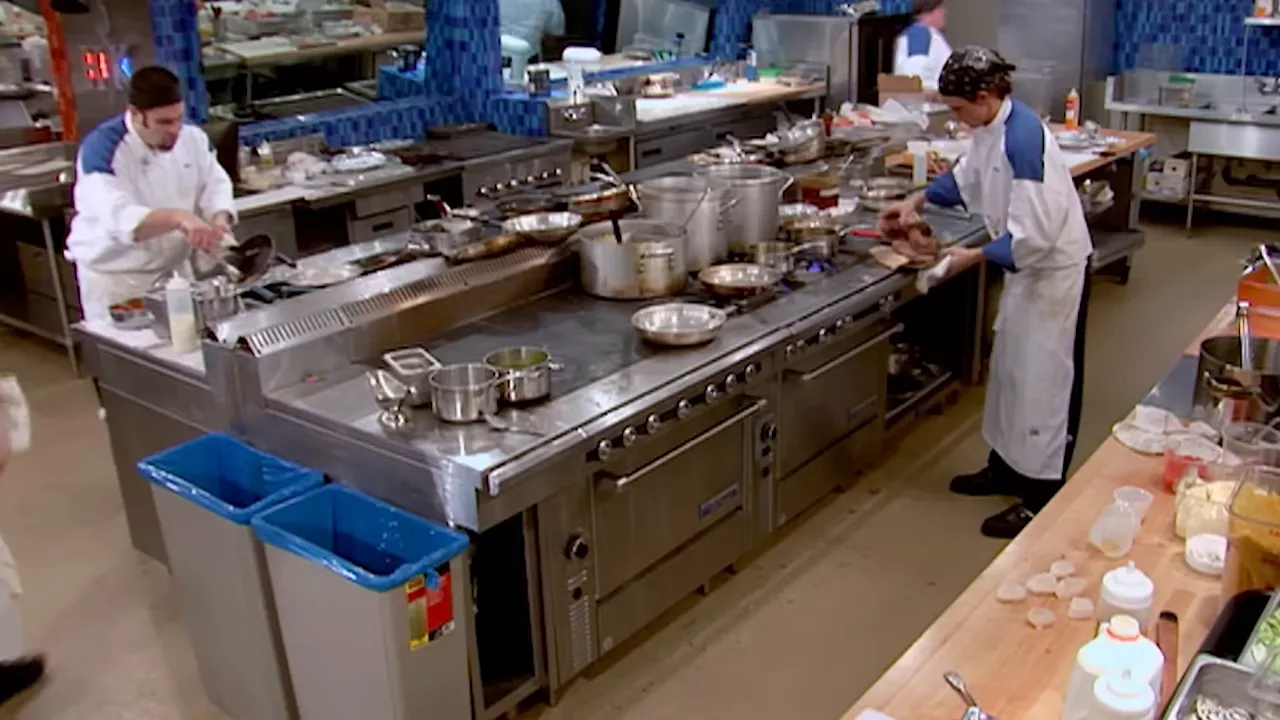 busy restaurant hot line during dinner service with chefs working