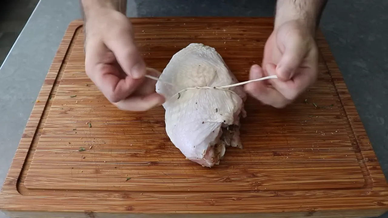 Tying the rolled turkey porchetta with kitchen twine