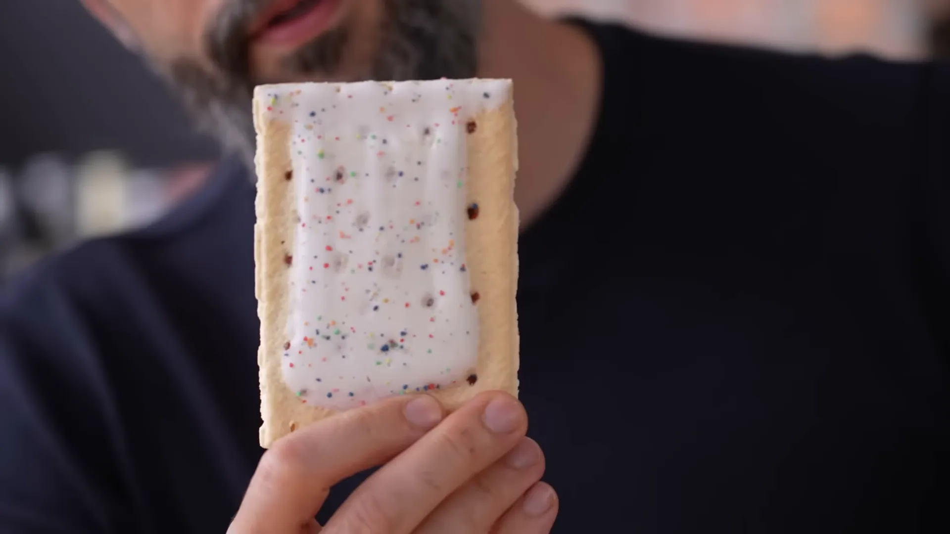 Frosted blueberry Pop-Tarts with sprinkles on a countertop