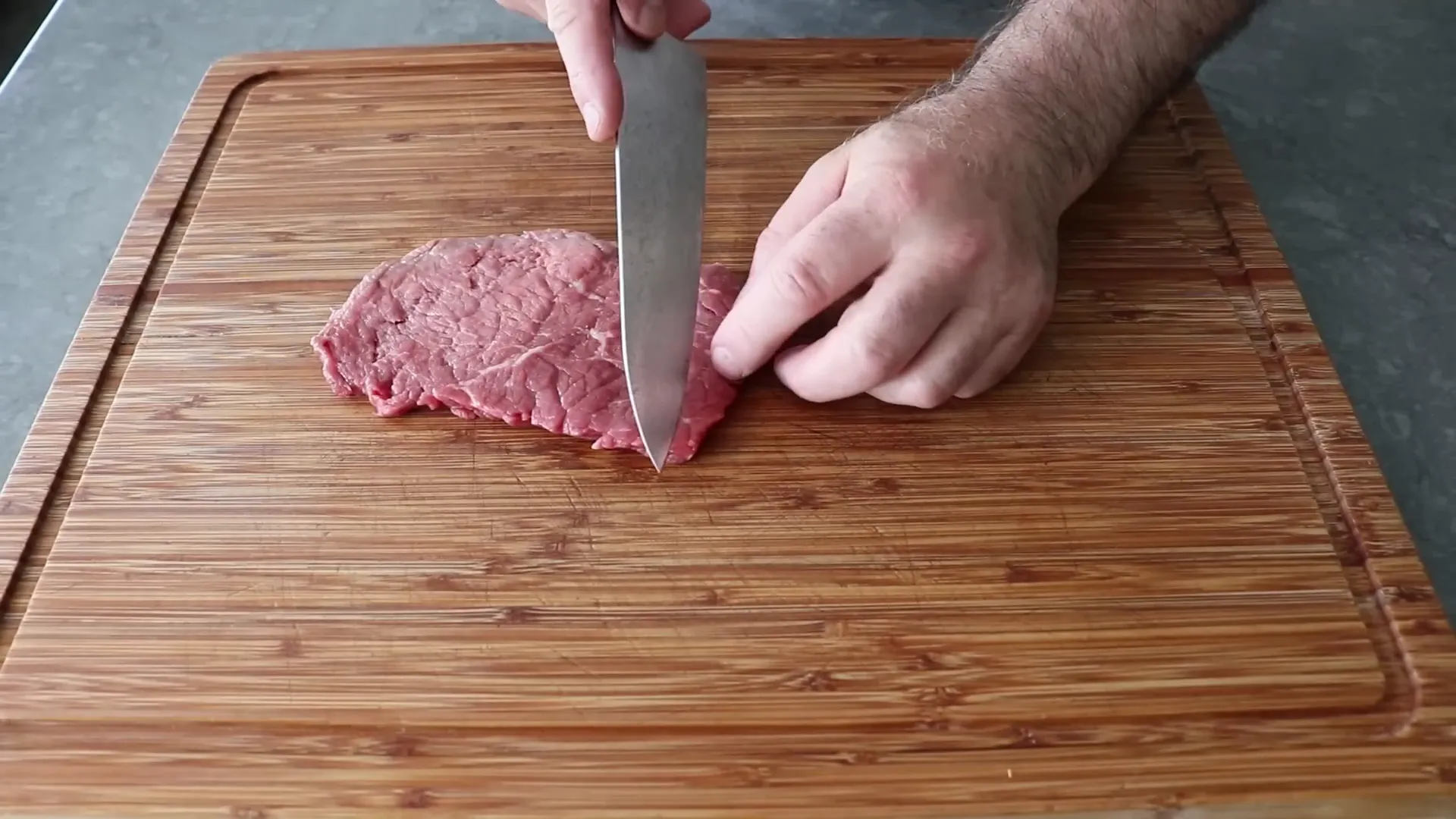 Demonstration of diamond cut steak slicing technique