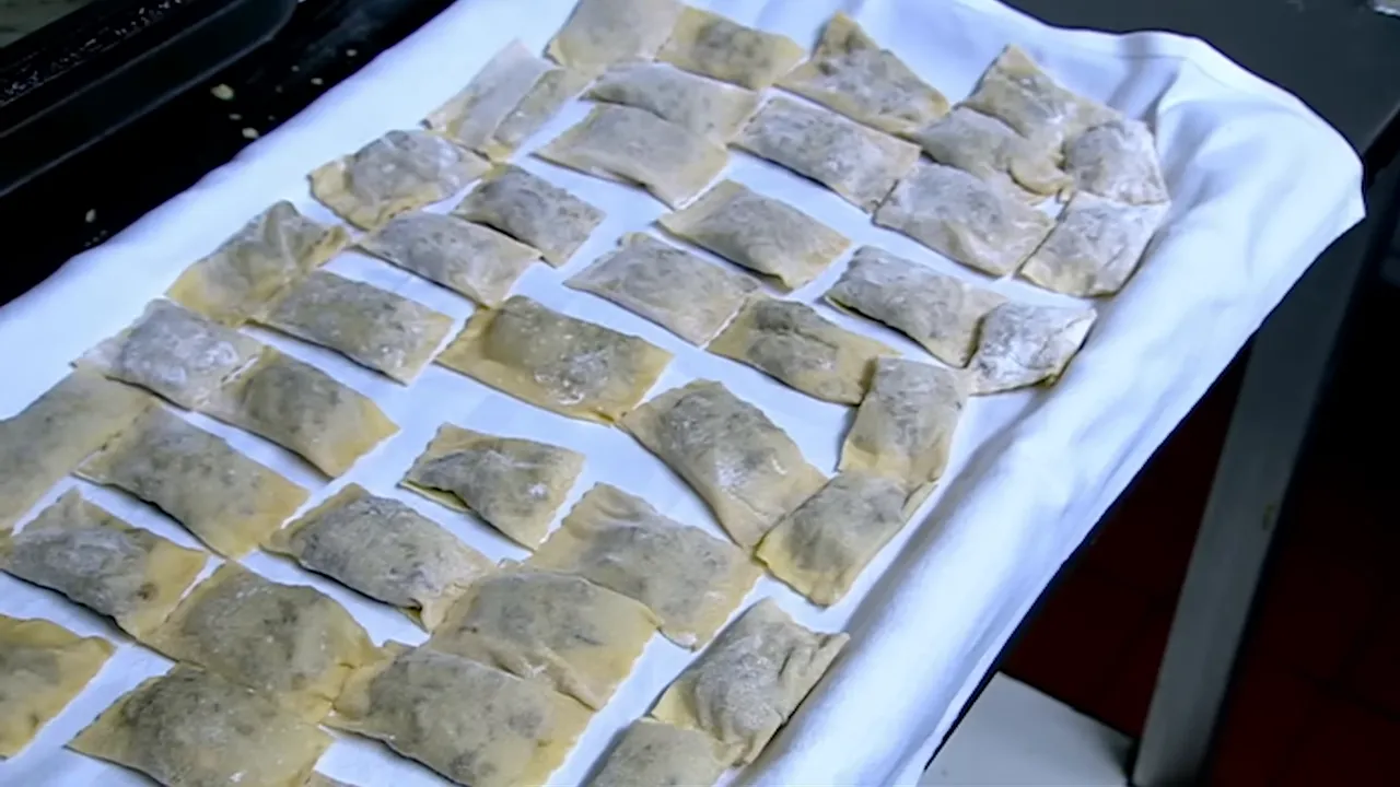 Alex proudly presenting handmade ravioli after the relaunch