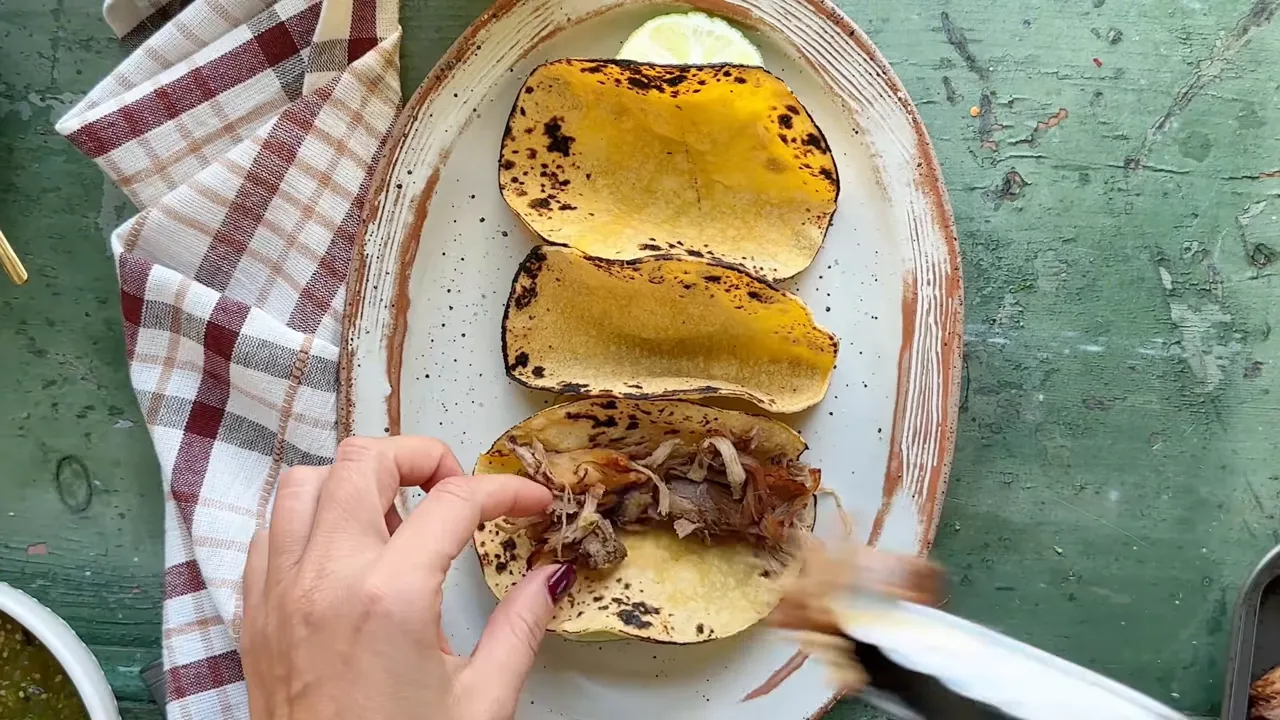 Shredded pork under the broiler to crisp edges