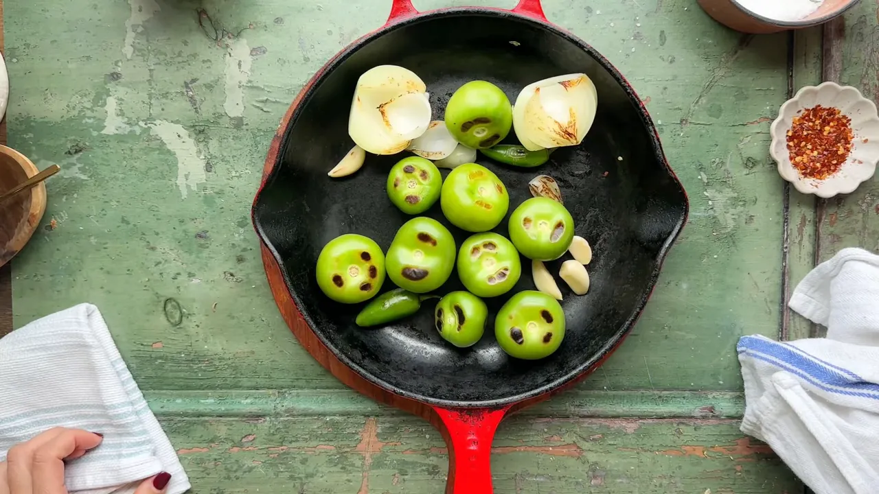 Blistering tomatillos, onions, garlic, and jalapenos for salsa verde