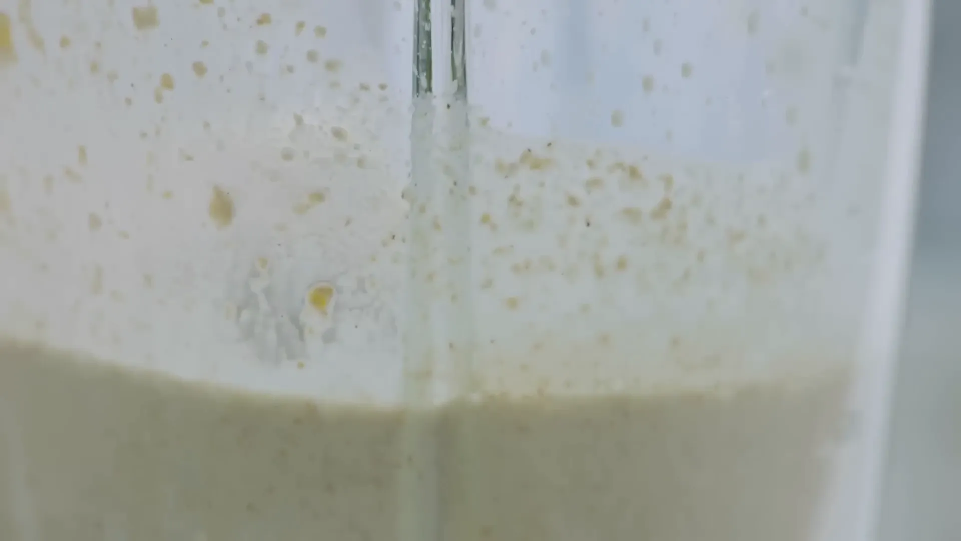 Mixing pancake batter with cardamom and spices