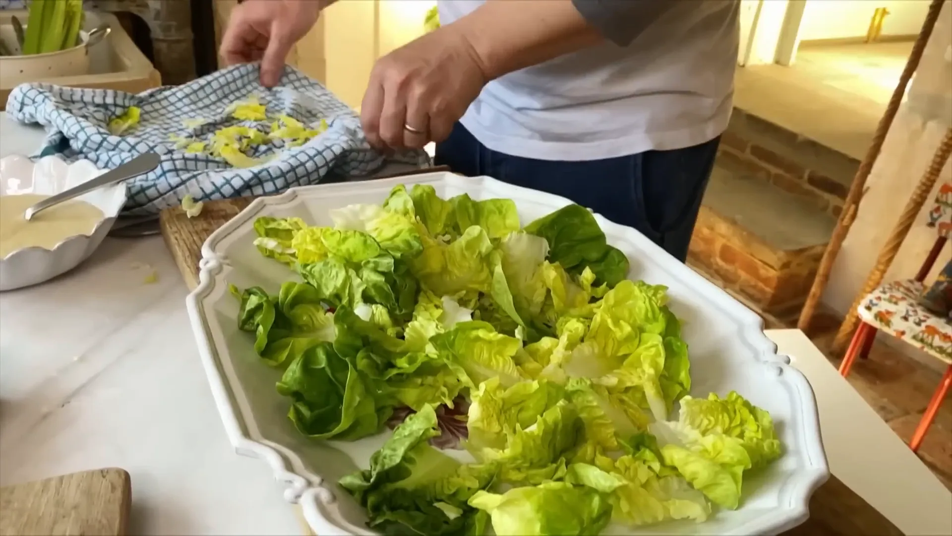Fresh lettuce leaves laid out with inner leaves cupped for dressing