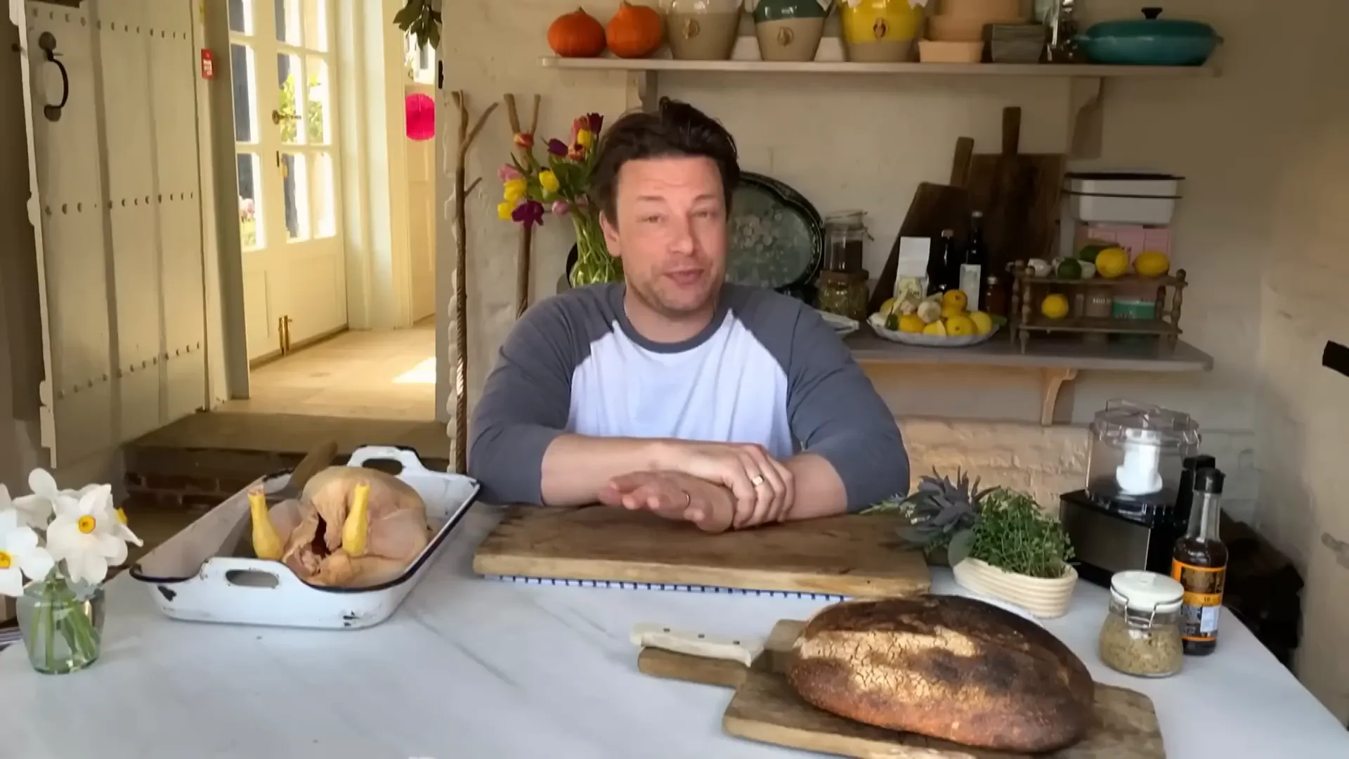 Ingredients for roast chicken Caesar salad including fresh herbs and garlic