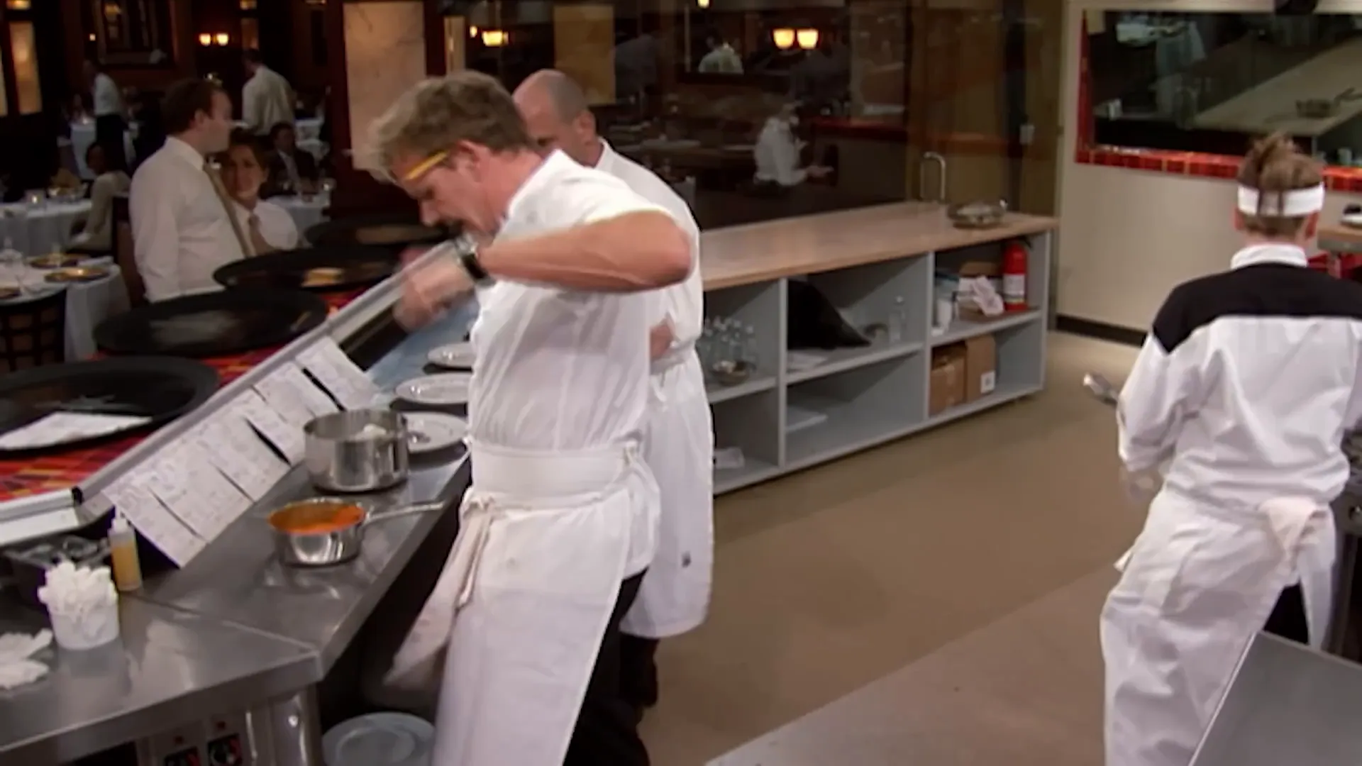 Chef Ramsay scolding Christina after she burns his hand