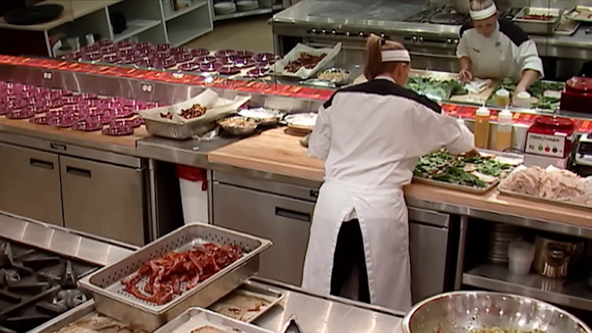 Christina calmly preparing food in the kitchen