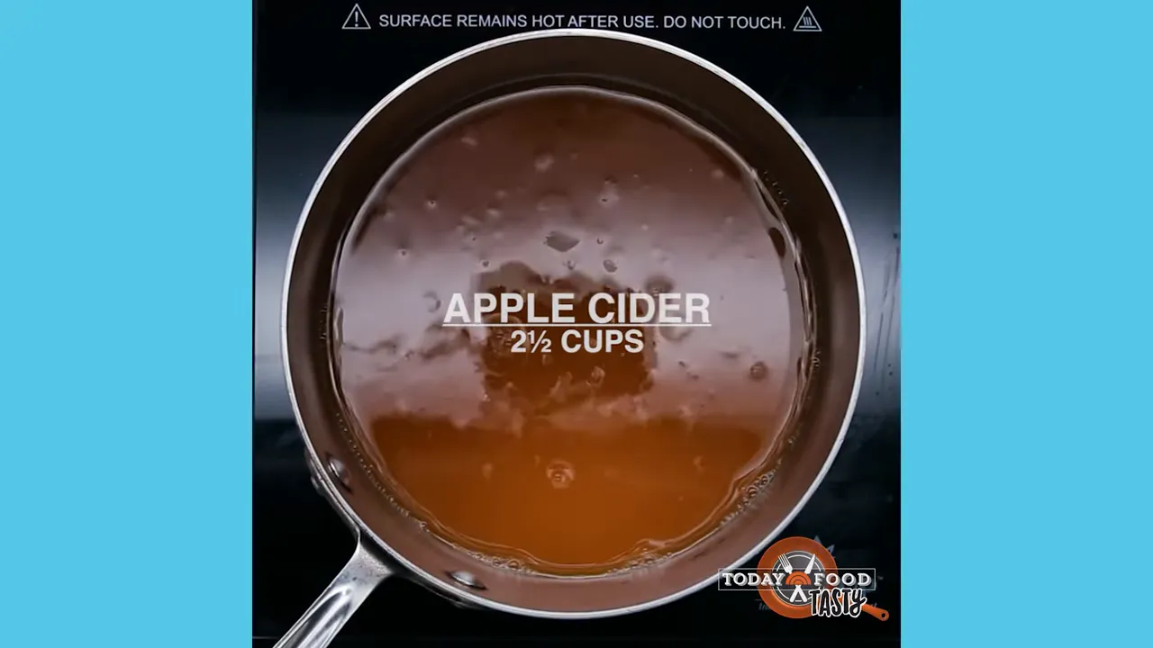 top-down pot of apple cider labeled 2½ cups being heated