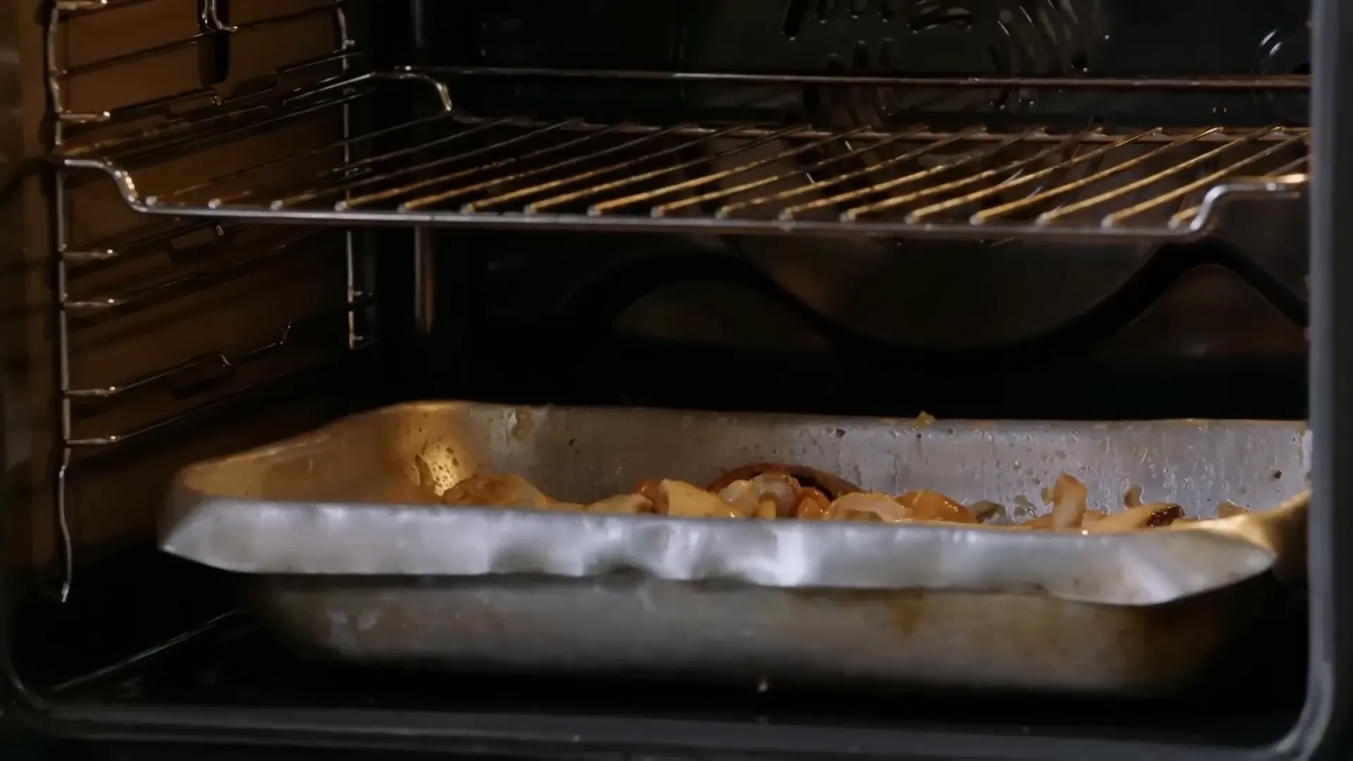 Mushrooms roasting and catching the chicken drippings