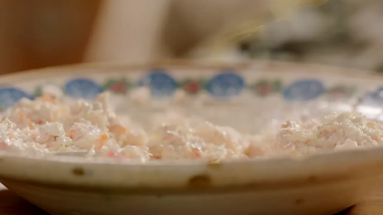 Close view of smoked salmon and seafood pâté in a shallow patterned bowl