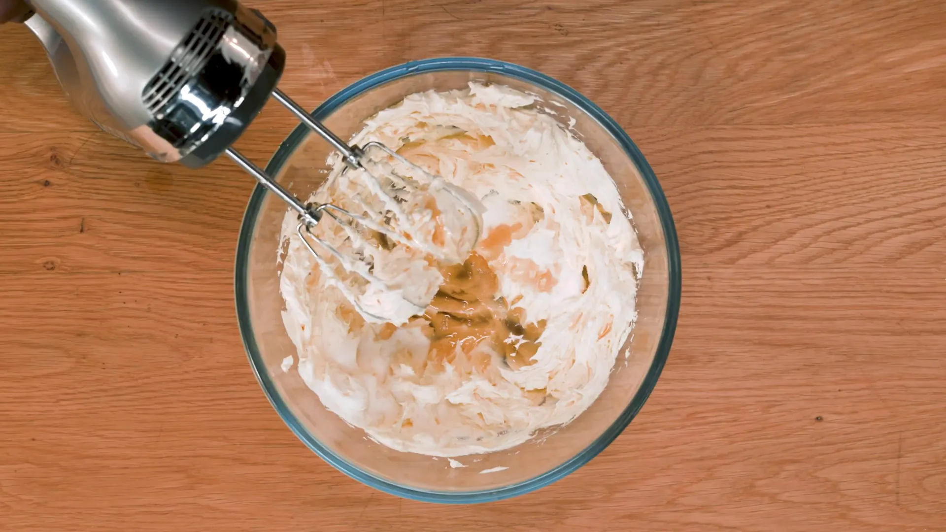 Whipping cream cheese with sugar and brandy