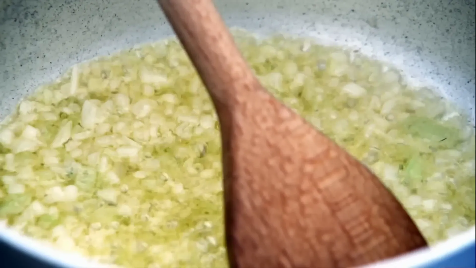 Soffritto of onions and celery sweating in olive oil