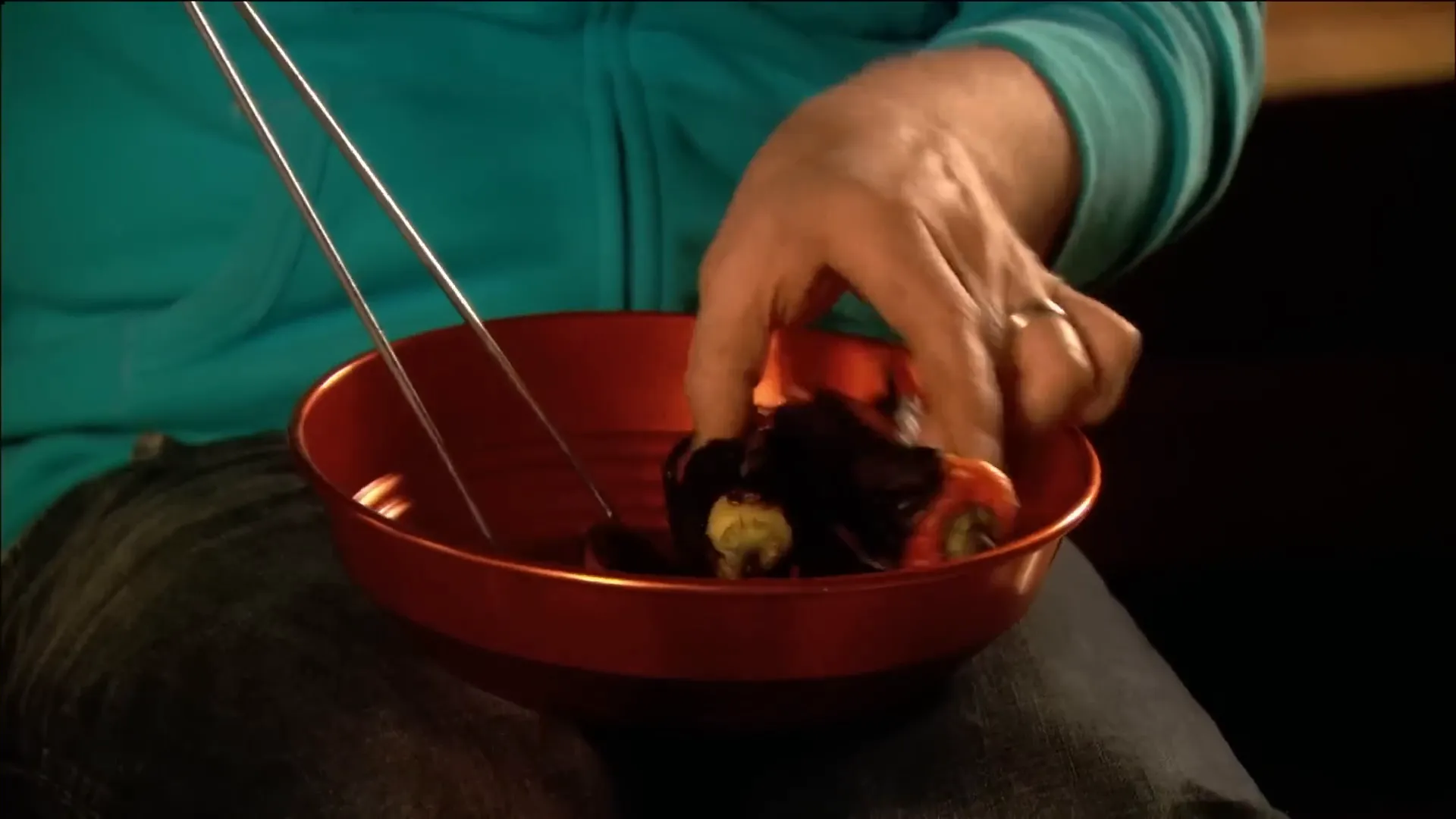 Blackened chili peppers being prepared