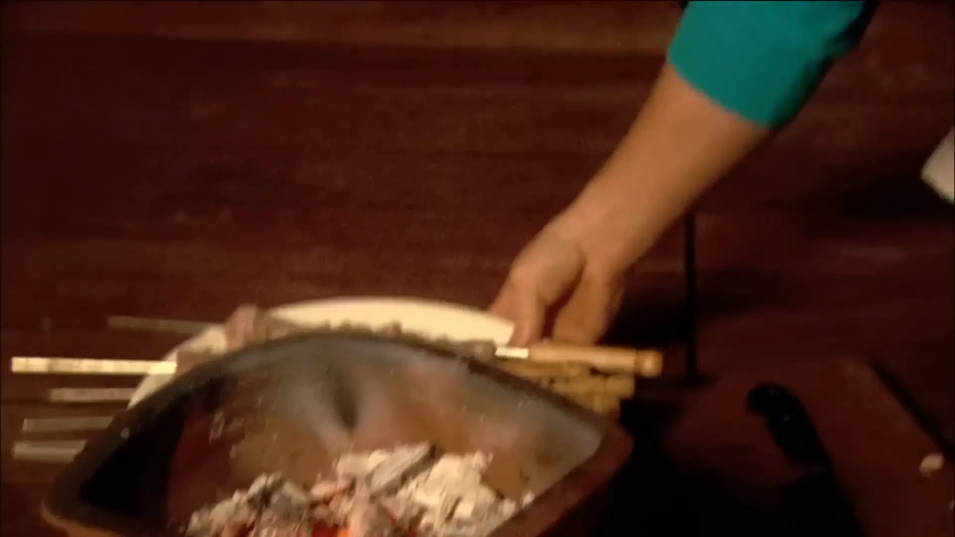 Pork kebabs cooking on a charcoal grill