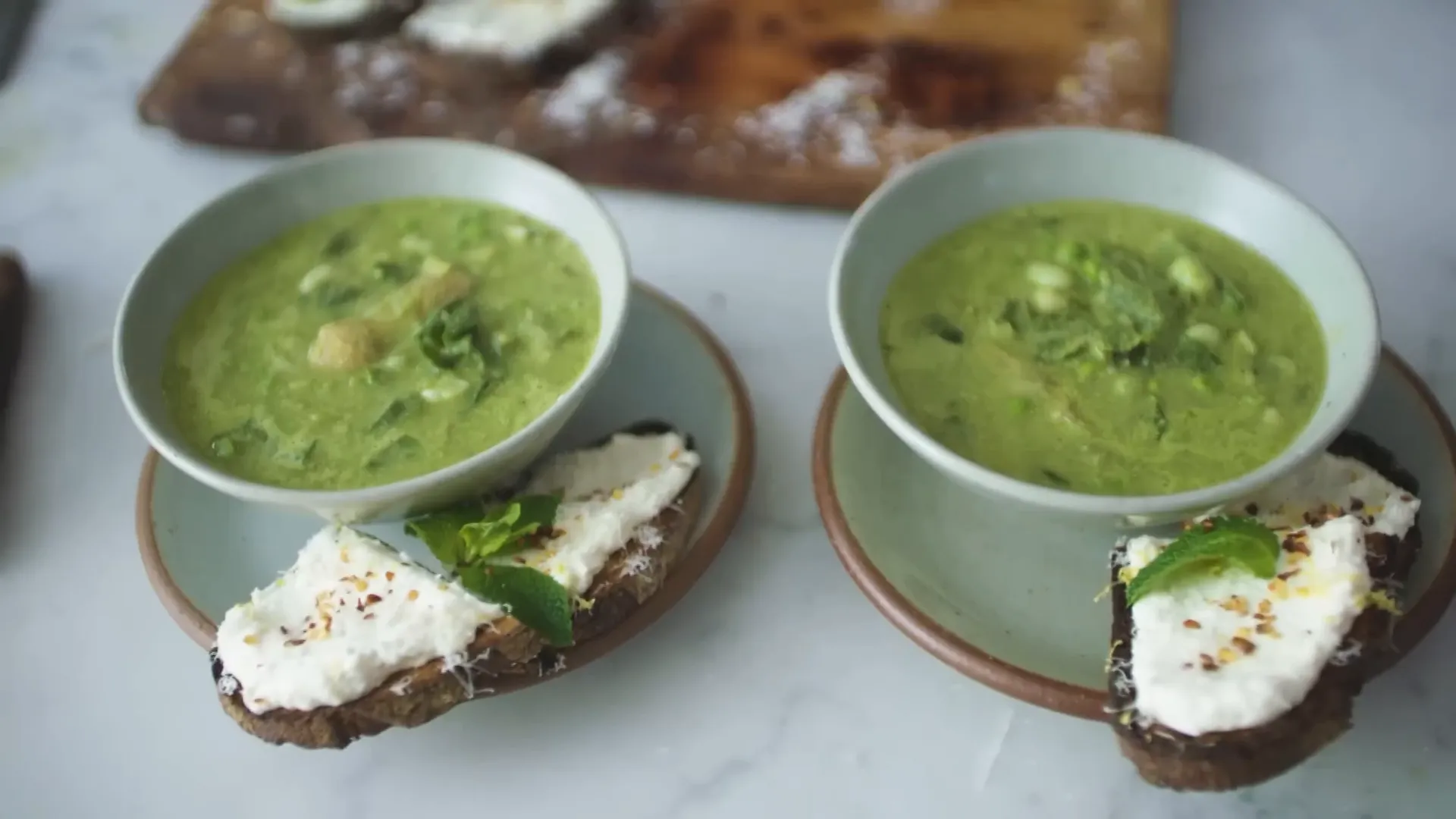 Serving the spring soup with ricotta toast on the side
