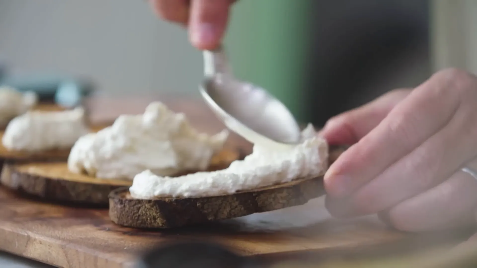 Whipped ricotta with lemon zest and parmesan ready to spread on toast