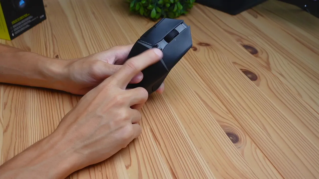 Close-up of side buttons and scroll wheel showing tilt capability