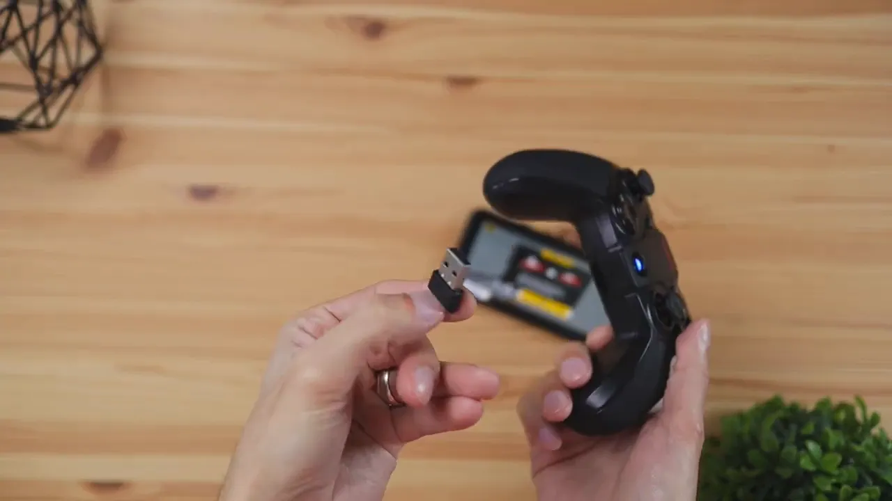 USB dongle being removed from the GameSir G4 Pro controller