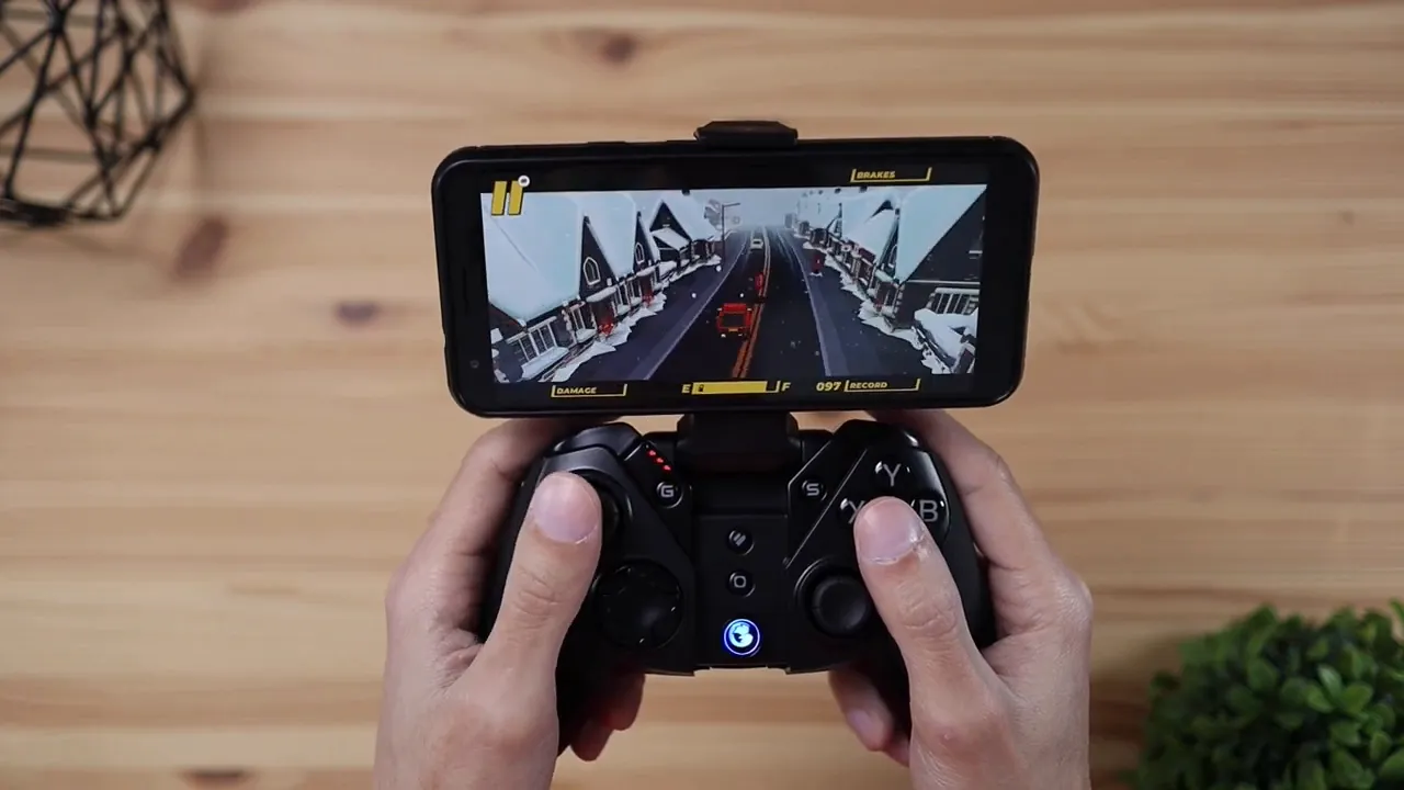 GameSir G4 Pro controller with phone mount playing on-screen mobile game