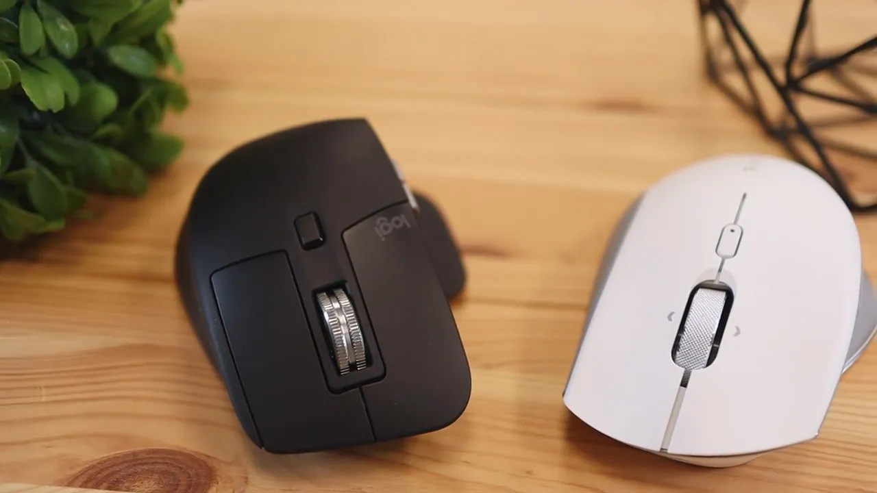 Top-down view of Logitech MX Master 3 and Razer Pro Click side by side on a desk