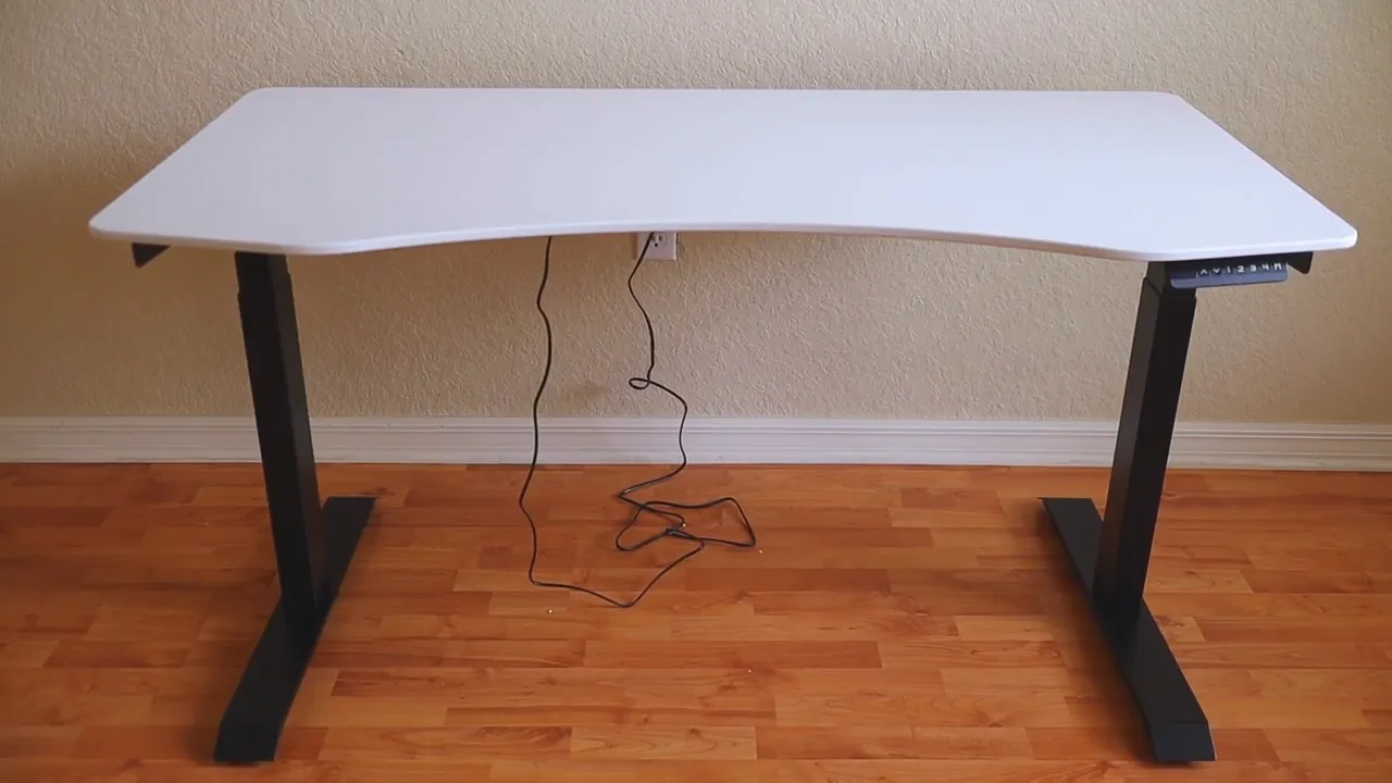 VORII ElementDesk with white curved tabletop, black three-stage steel legs and control keypad with cables underneath