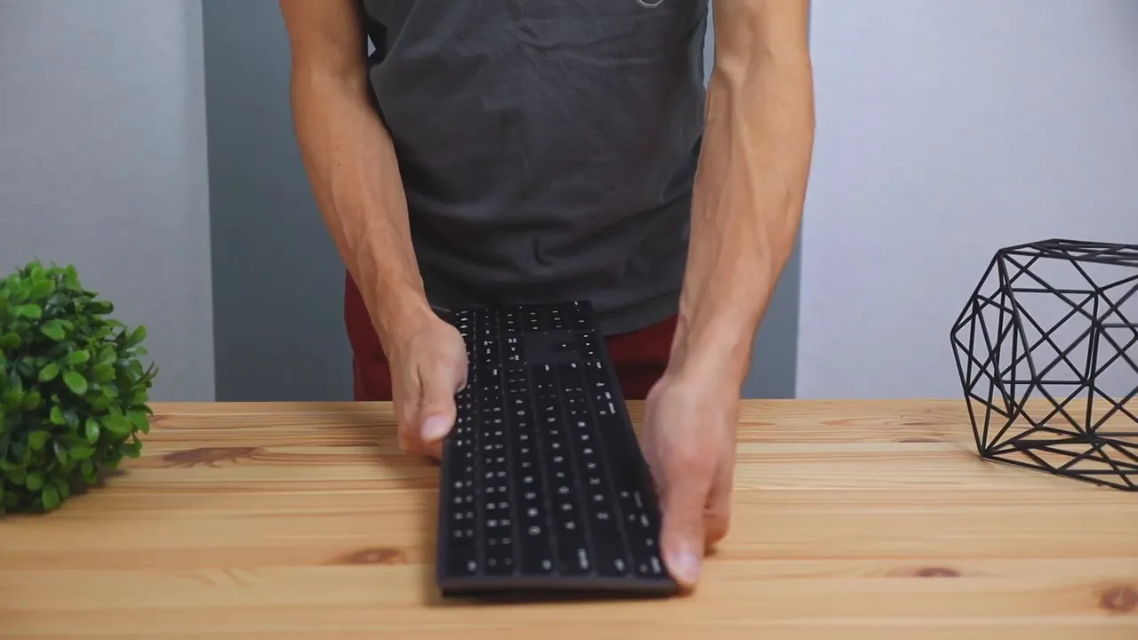 Person bending the Seenda wireless Bluetooth keyboard during a flex test