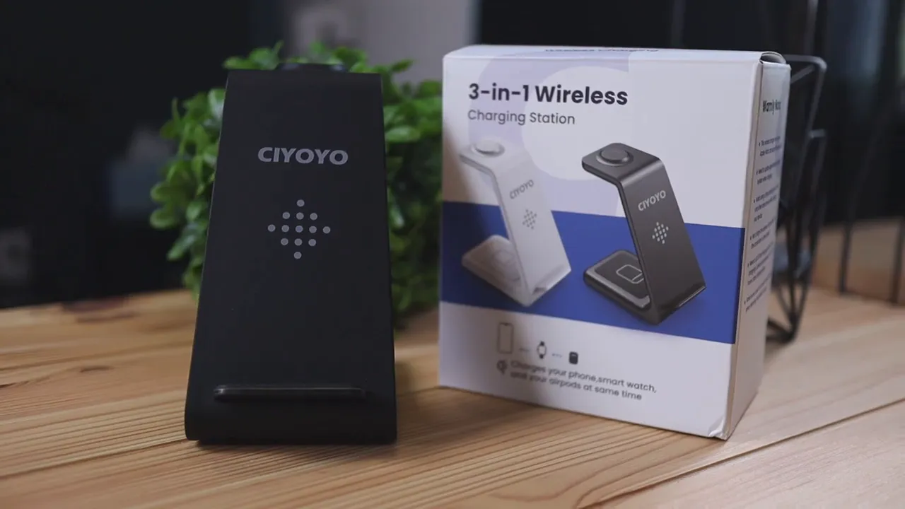 CIYOYO 3-in-1 wireless charging stand beside its box on a wooden desk, clear product branding visible