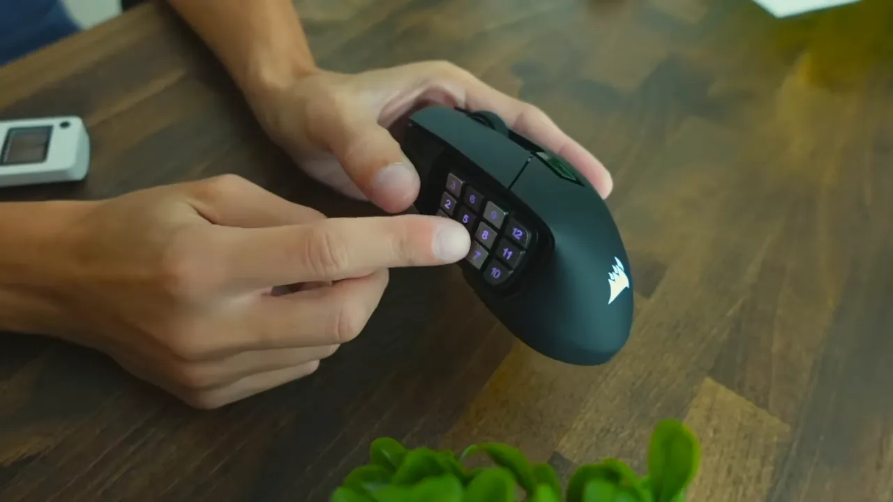 RGB lighting glowing on the side buttons and Corsair logo in dim lighting