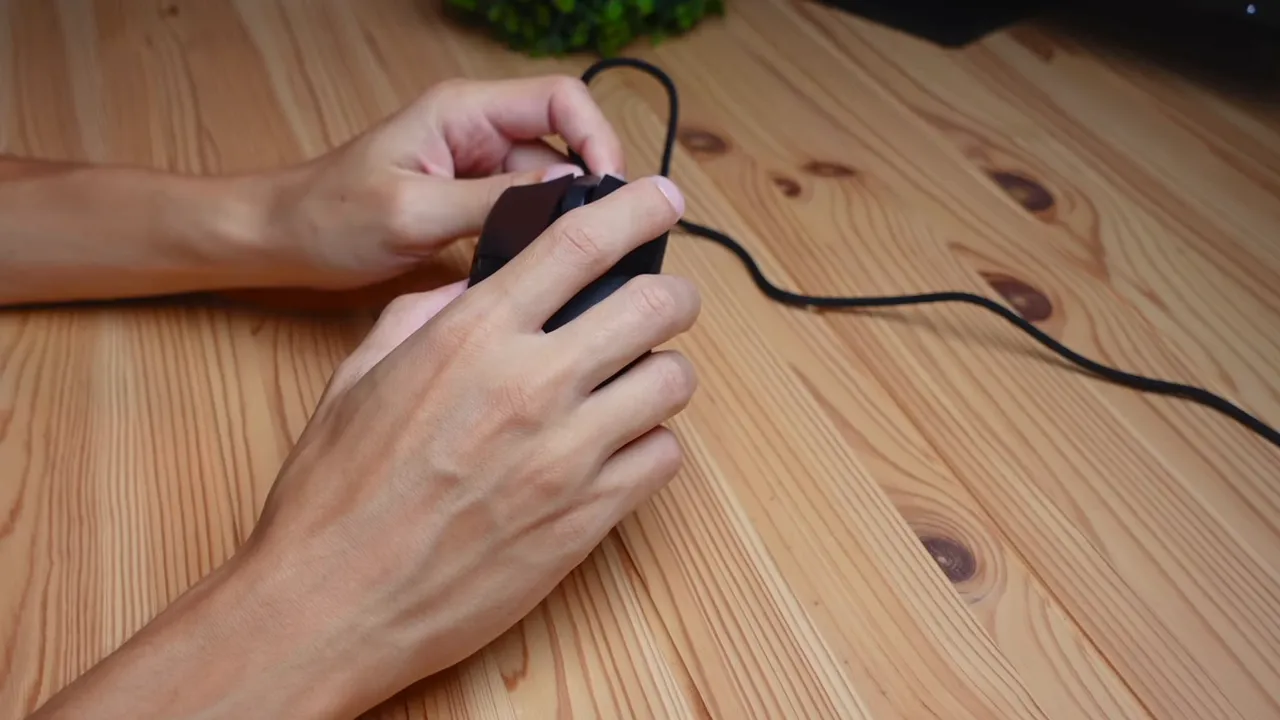 Unboxed Razer Cobra mouse, instruction manual and stickers