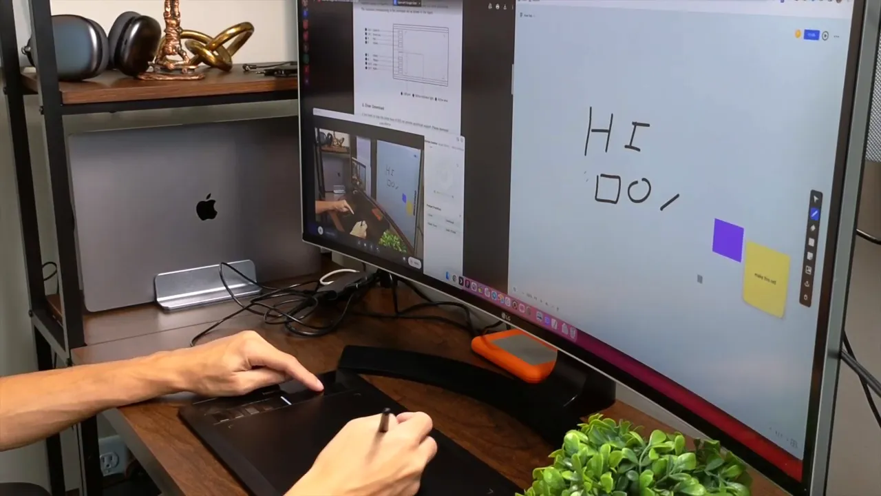 Close view of a hand pressing the left-side shortcut buttons on a NEARHUB S13 drawing tablet with stylus in the other hand