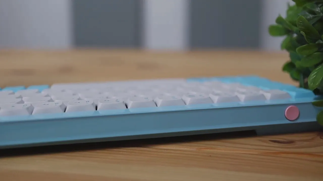 Clear side profile of the Morgrie RKB 68 top edge with white keycaps and pink power button