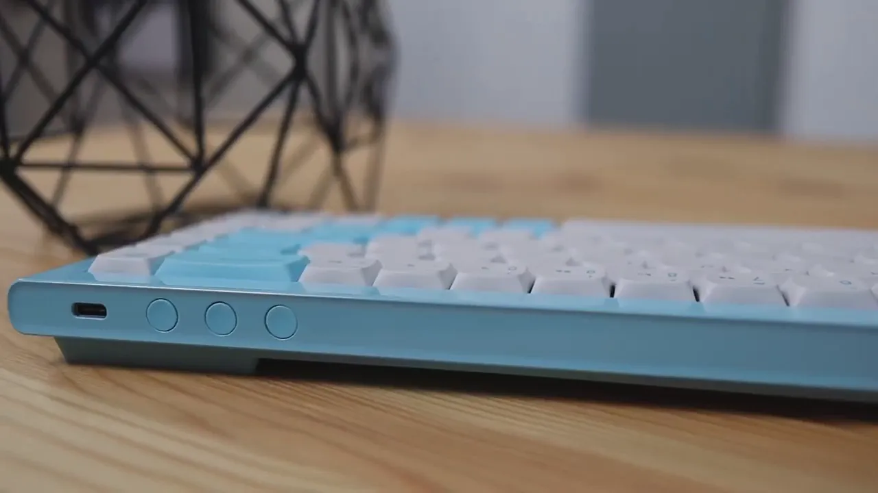 Side angle view of the Morgrie RKB 68 keyboard showing round buttons and connection port