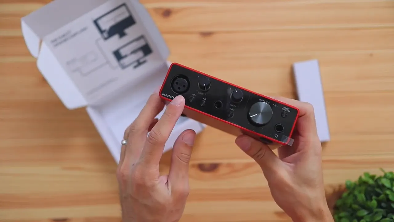 Close-up of Focusrite Scarlett Solo front panel with knobs and XLR input for microphone setup