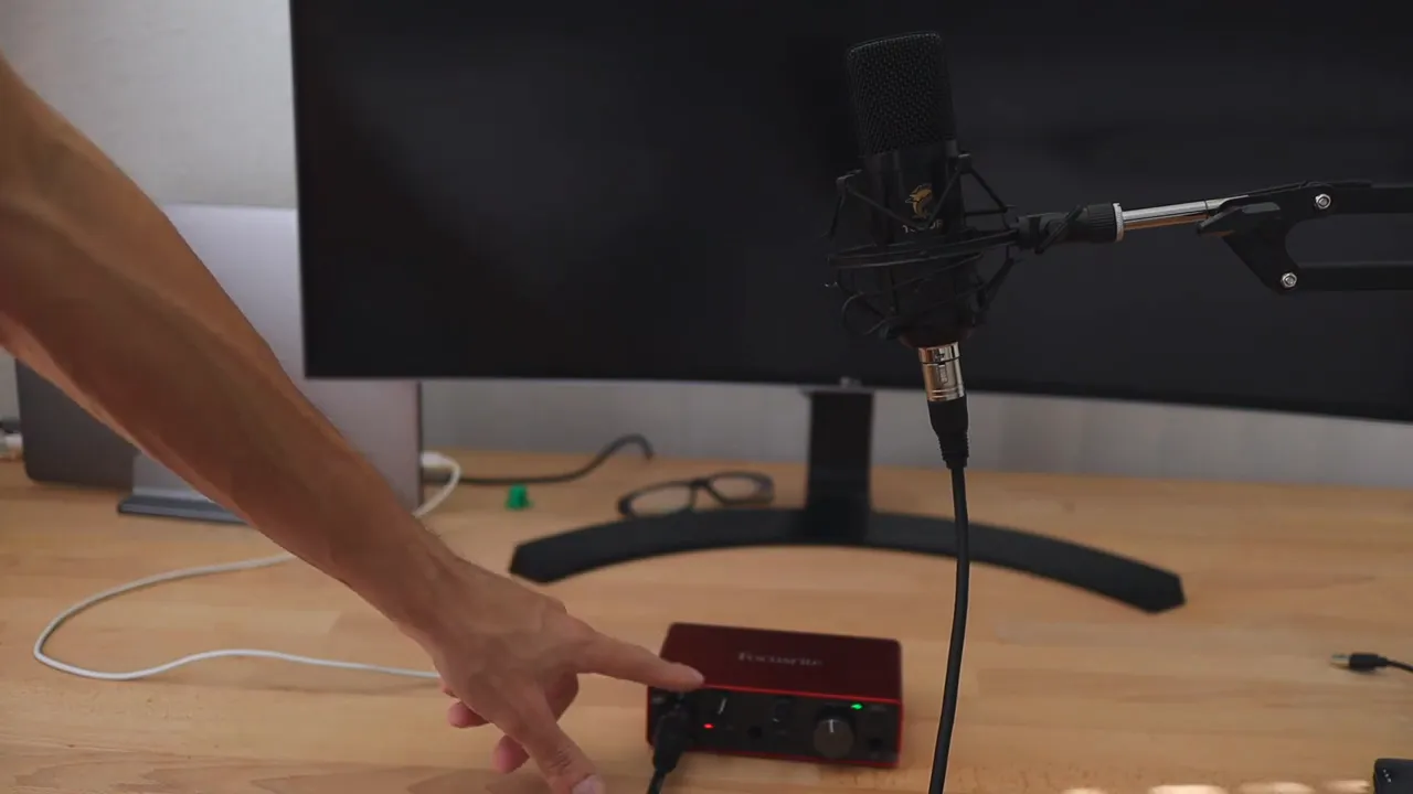 Green LED level indicator on Focusrite Scarlett Solo reacting during microphone test