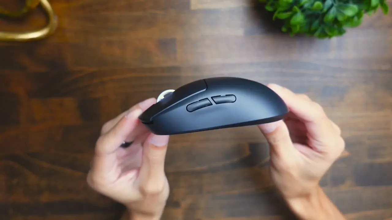 Holding the Logitech G PRO X Superlight 2 showing how light it feels