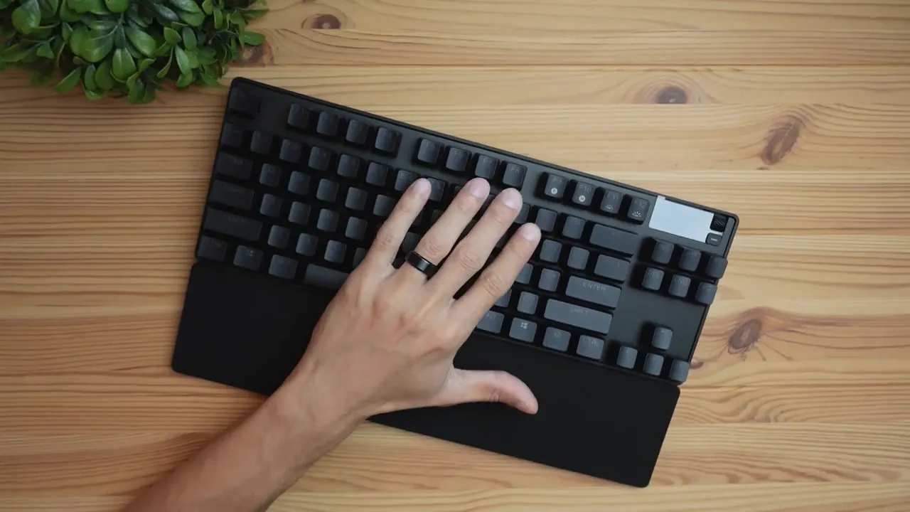 Top-down SteelSeries Apex Pro TKL keyboard with magnetic wrist rest and visible control cluster