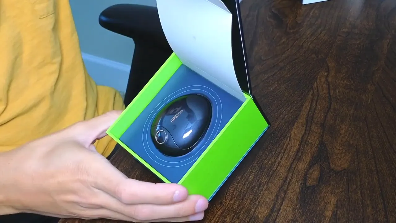 Mifo HiFiDots charging case clearly visible inside the green presentation box