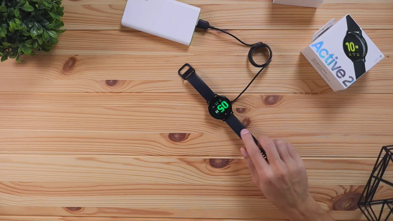 Samsung Galaxy Watch Active 2 on charger showing charging icon