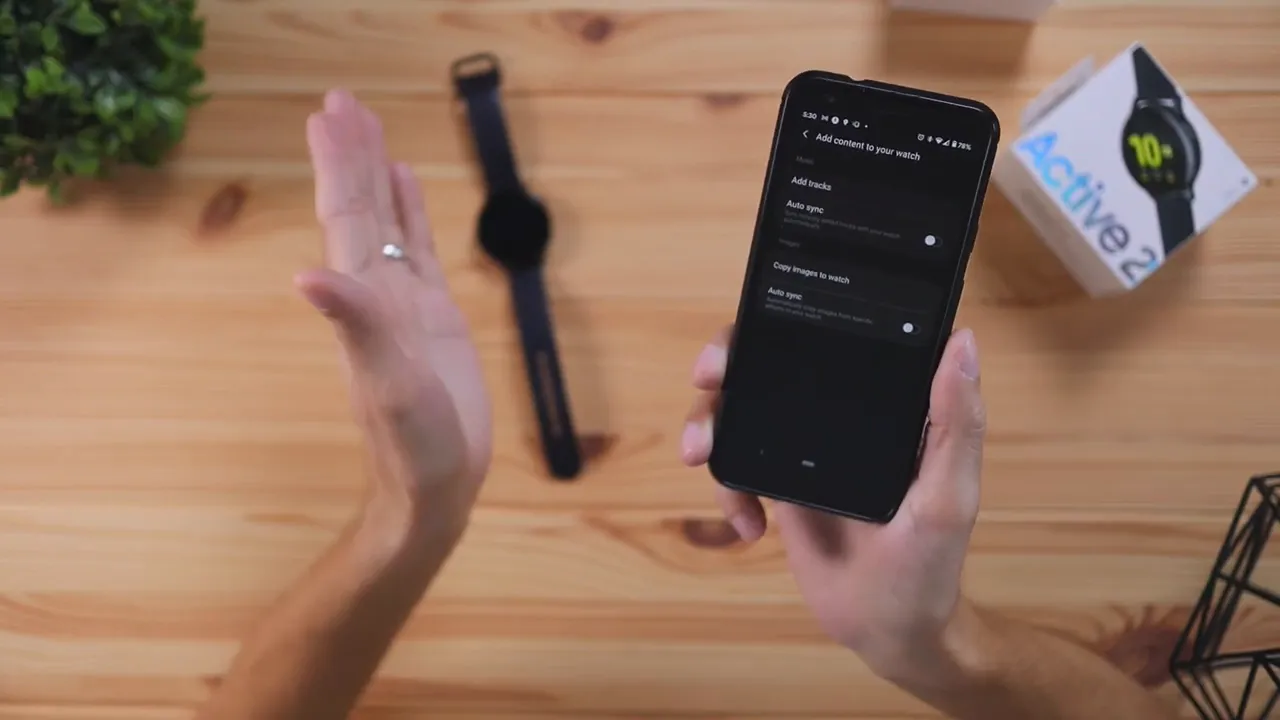Galaxy Wearable app screen showing add content to your watch with add tracks and copy images options