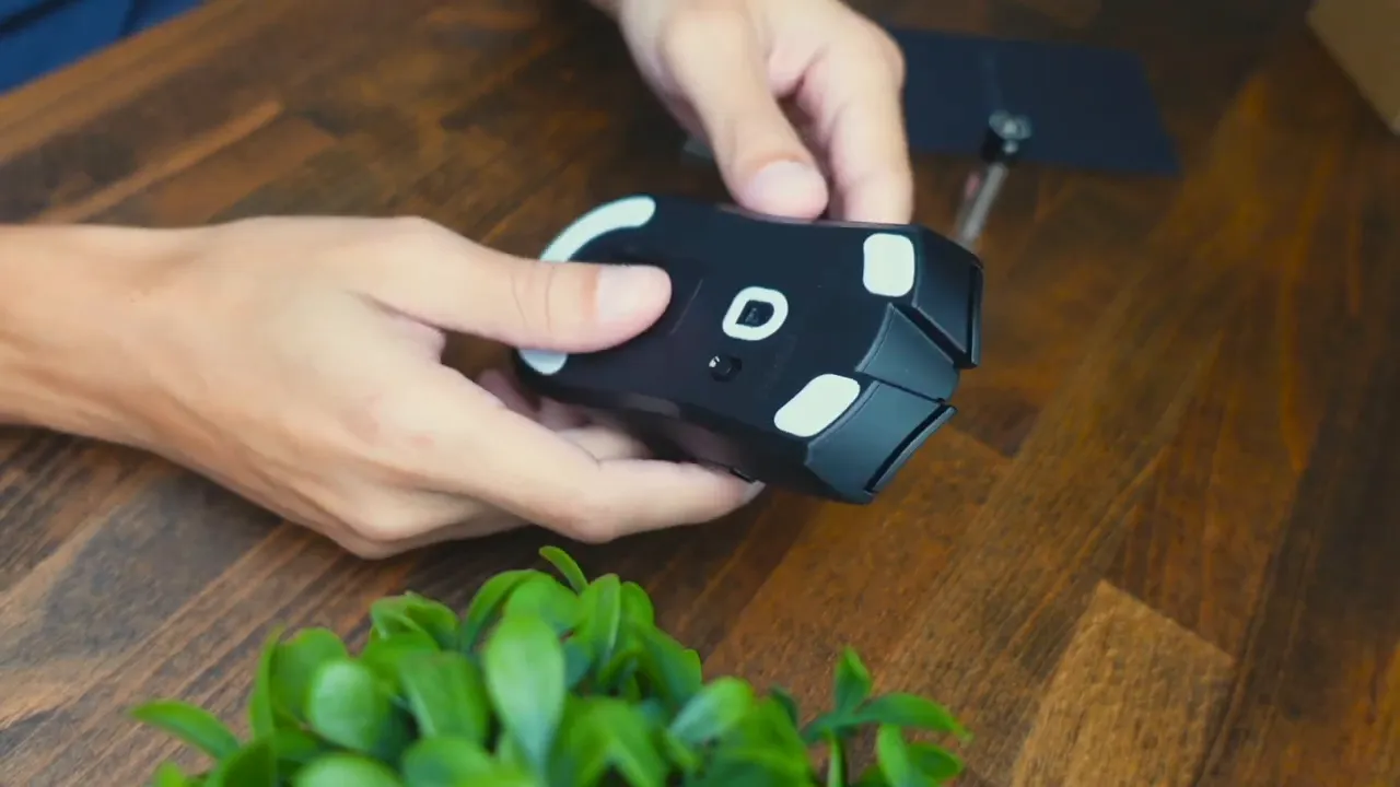 HyperSpeed dongle being removed from inside the mouse