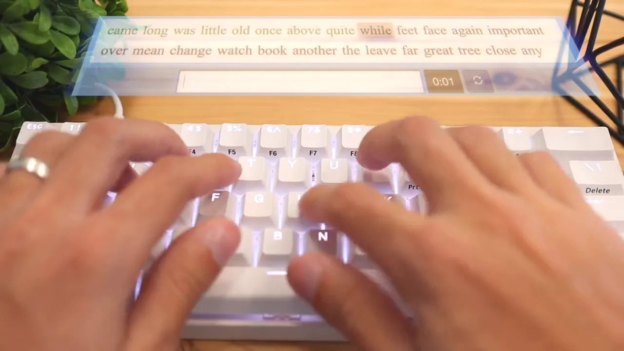 Hands typing on the white keyboard with a typing test overlay showing 83 WPM