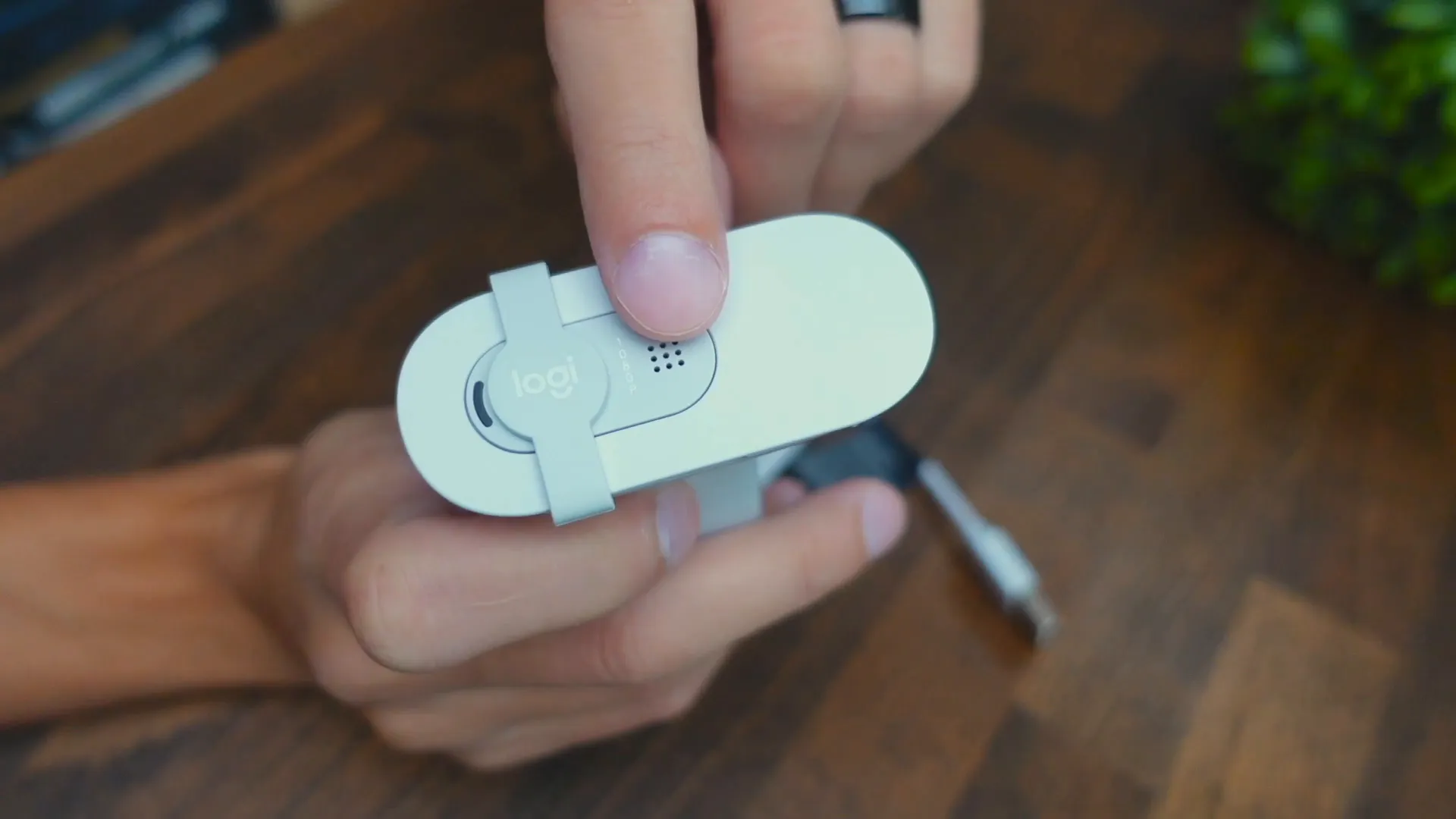 Demonstrating the privacy shutter of the Logitech Brio 100