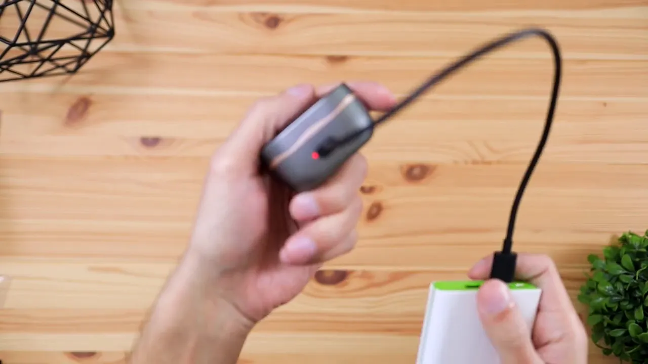 Close-up of SoundPEATS Sonic charging case showing the charging indicator light