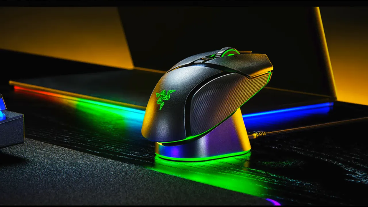 Razer Naga V2 Pro mouse seated on a Razer contact charging dock with RGB lighting