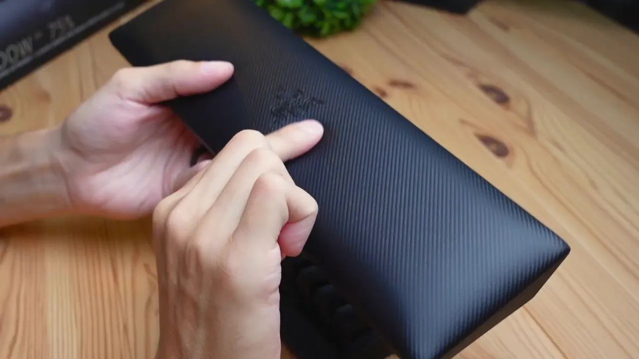 Magnetic leatherette wrist rest squished to show plushness