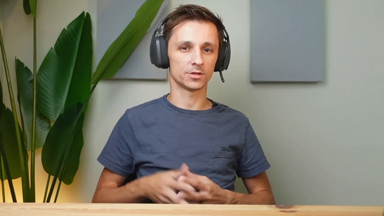 Zone Vibe 100 propped on head with boom mic down in professional setting