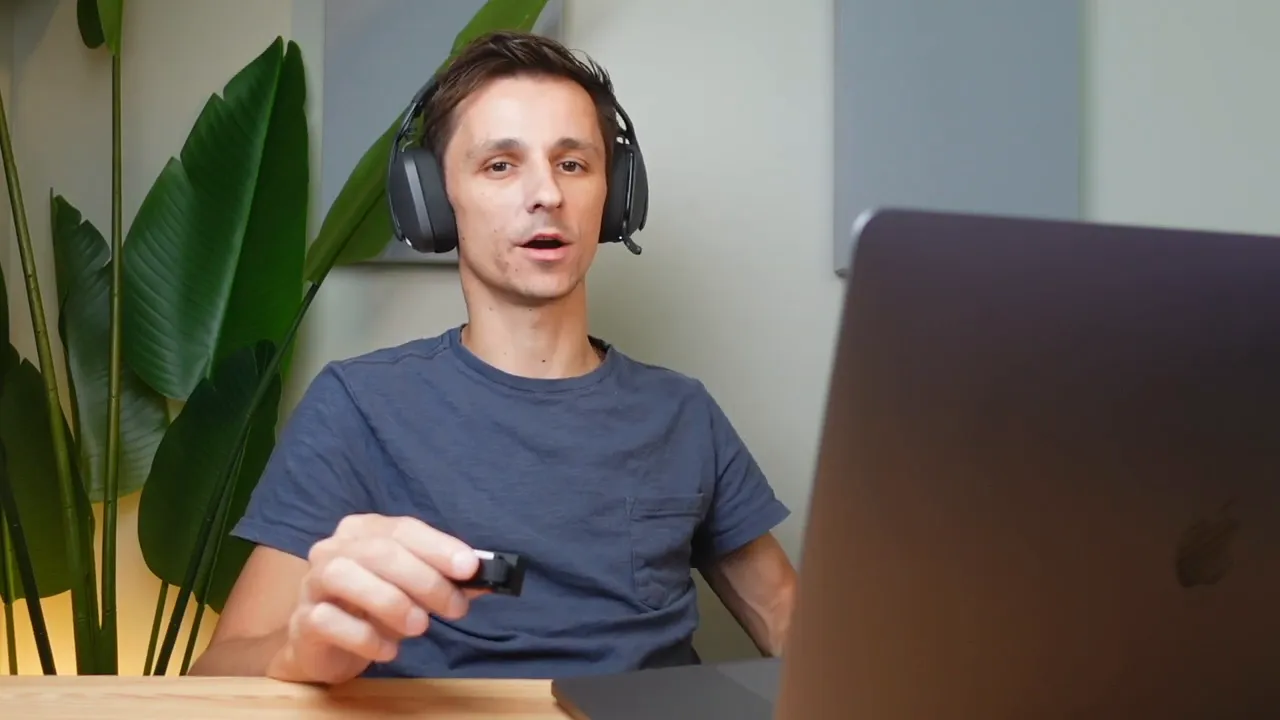 Person speaking while wearing headset showing boom mic position