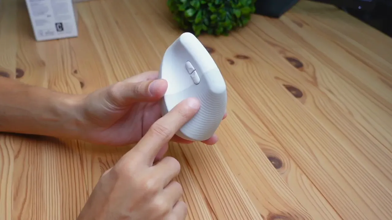 Close-up showing rubber thumb grip and textured finish